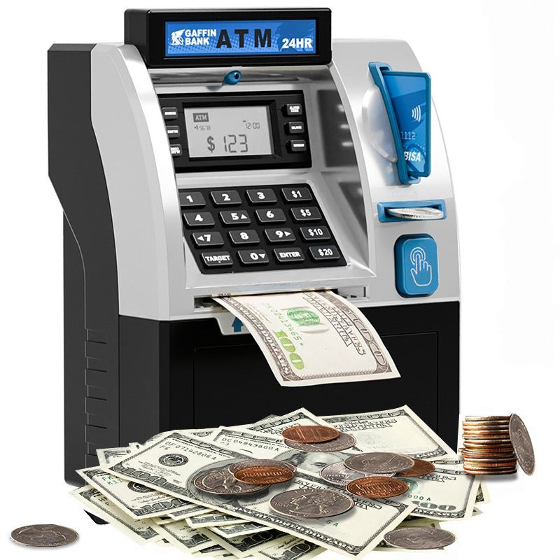 Toy ATM machine with money and coins on a white background