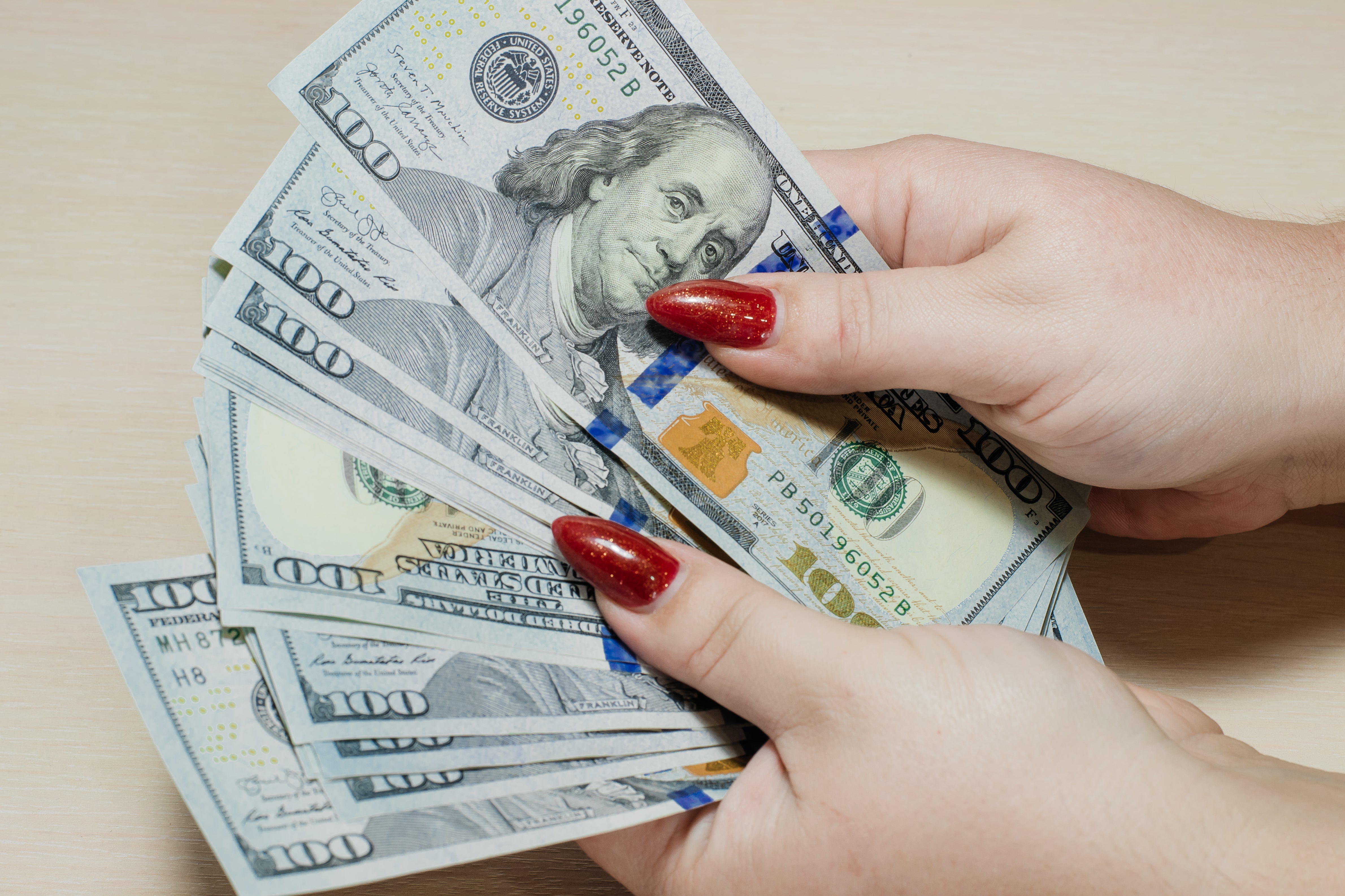 files/us-dollars-women-s-hands-man-counting-money-concept-global-economy.jpg